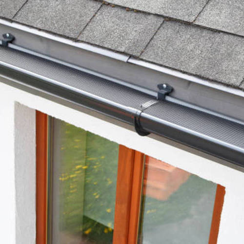 gutter guards along a shingle roof